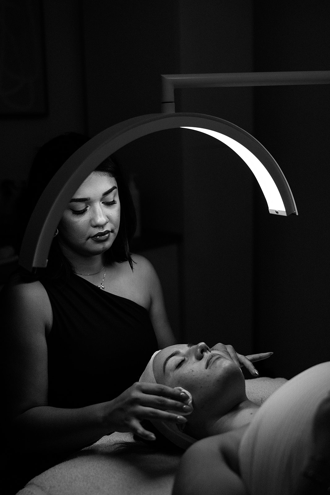 Maria performing a skin treatment